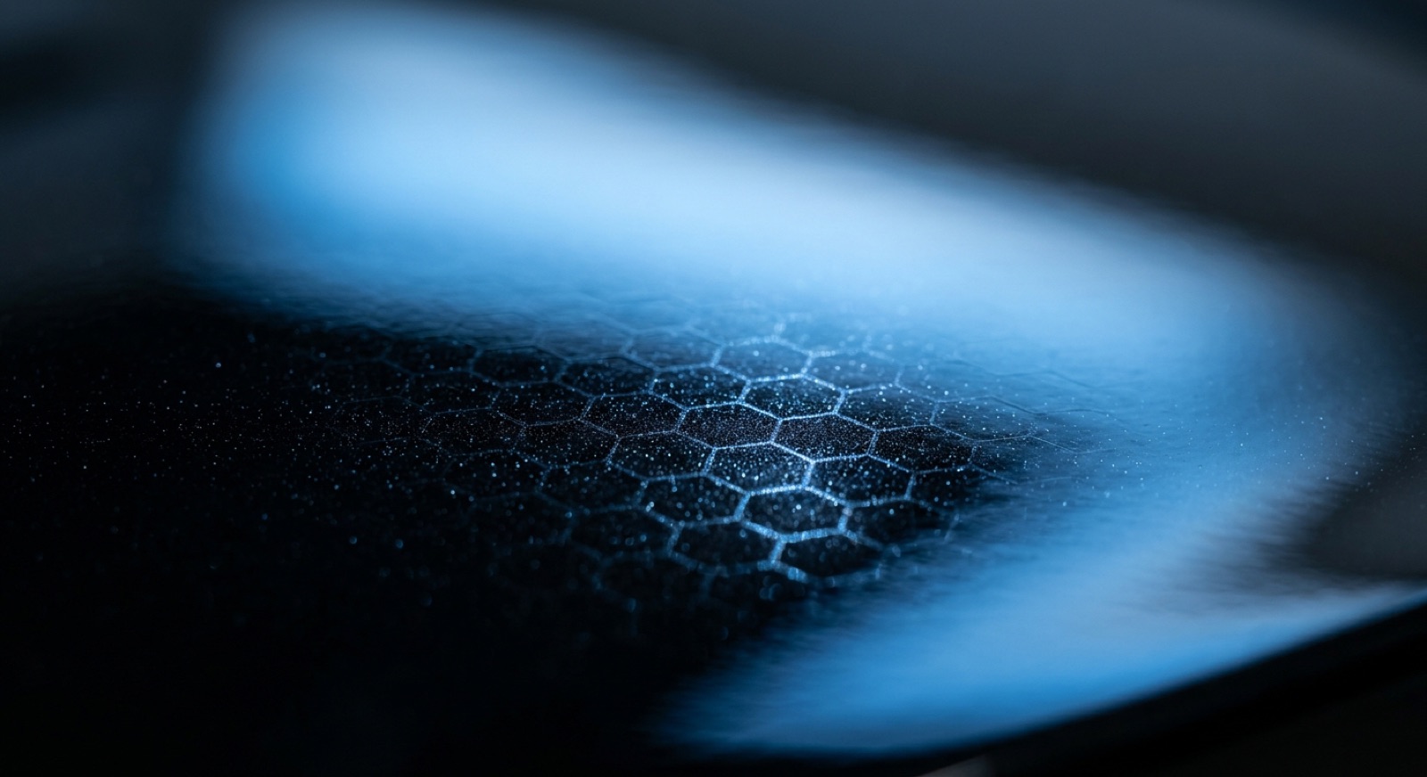 Close-up of the Kovalent Graphene Matrix graphene lattice over deep gloss car paint