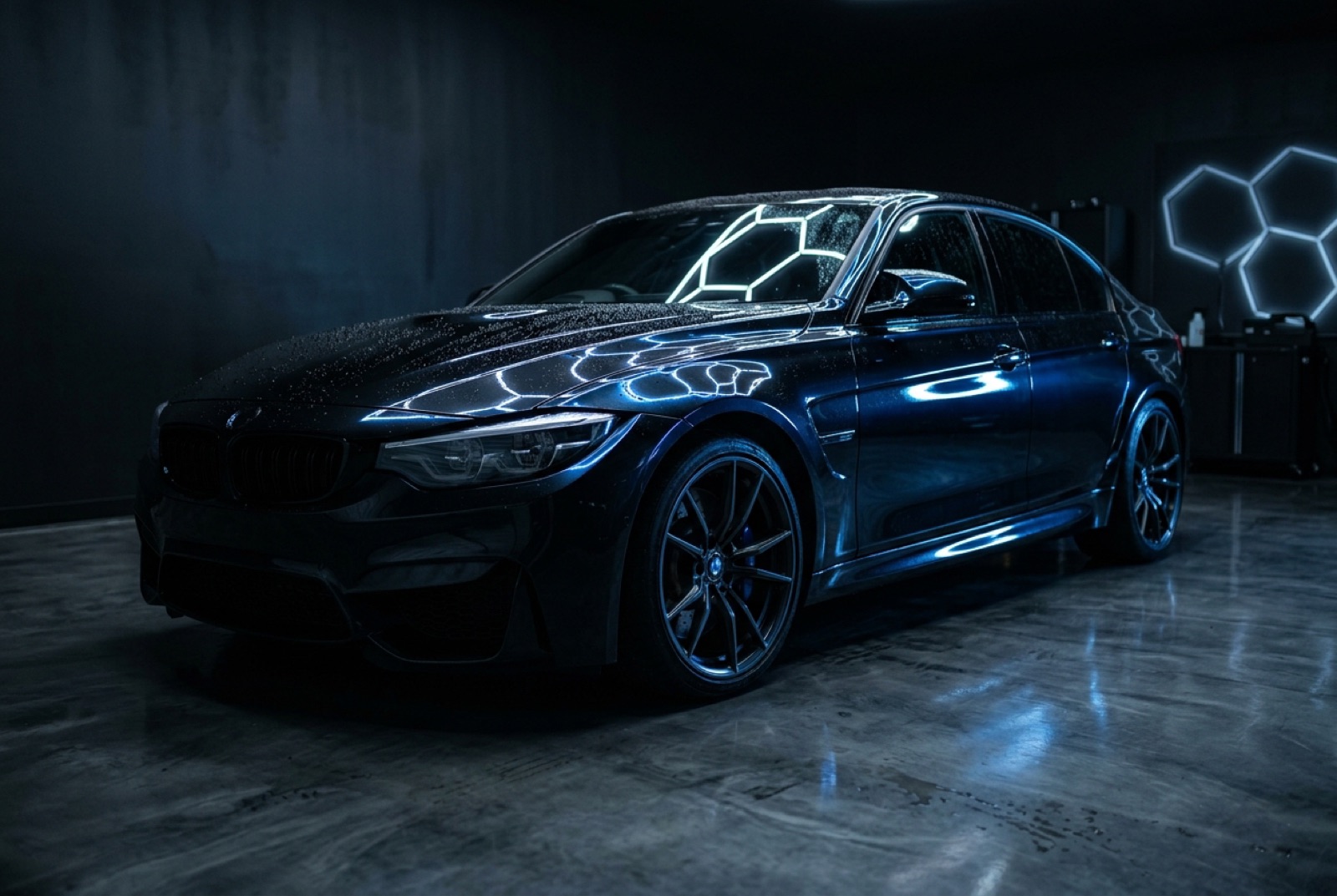 Graphene paint protection on a glossy black luxury car with water beading after a Kovalent Graphene Matrix coating